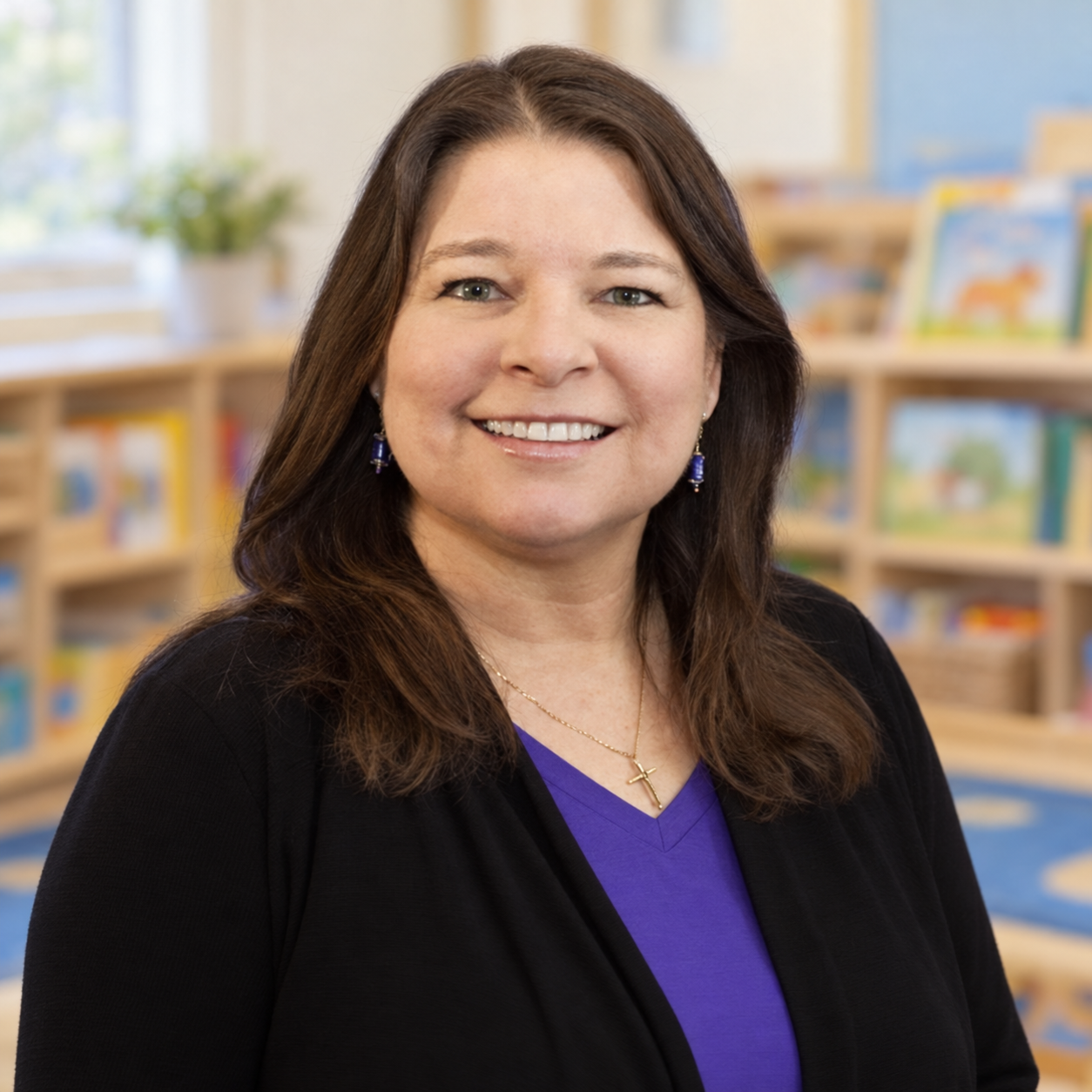 Sharon Burgess smiling in a preschool classroom